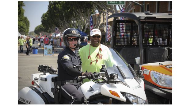 Police officer and a committee member pose together at the event