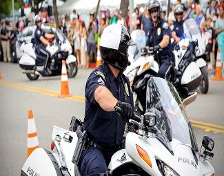 Motorcycle police officers and crowd