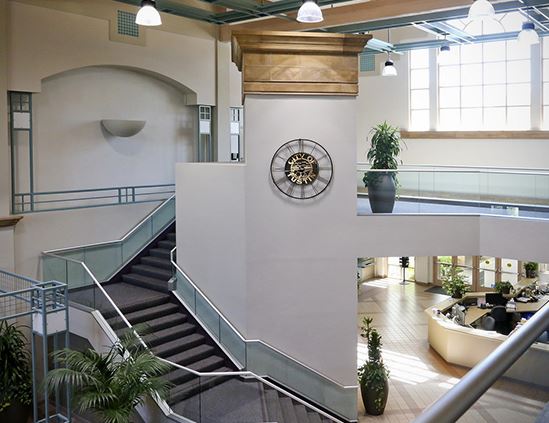 view of stairs and clock at the city hall